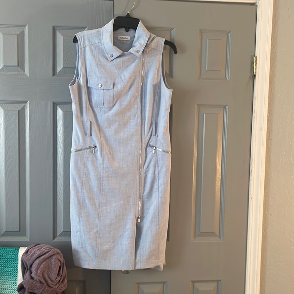 Calvin Klein dress made out of made out of light blue denim looking fabric.